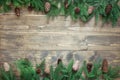 Christmas decoration composition of fir tree branches on wooden background with copy space. Top view. Template. Royalty Free Stock Photo