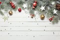 Christmas or New Year decoration background: fur-tree branches, colorful glass balls and glittering stars on white Royalty Free Stock Photo
