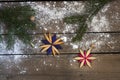 Christmas New Year decoration composition. Top view of fur-tree branches and star frame on wooden background Royalty Free Stock Photo