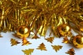 Christmas and New year decor gold balls and tinsel white background Royalty Free Stock Photo