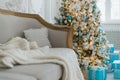 Christmas or new year decoration at Living room interior and holiday home decor concept. Calm image of blanket on a vintage sofa Royalty Free Stock Photo