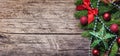 Christmas and new year decoration on rustic wood textured background. Vintage holiday banner layout with xmas ornamet and fir tree