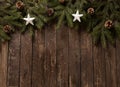 Christmas, New Year decoration with star shaped and winter holiday motives on top of evergreen branches and rustic wooden