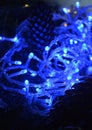 Christmas and New year decorations fir cones and blue lights holiday background Royalty Free Stock Photo