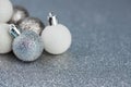 Christmas and new year decorations. Sillver baubles on sparkle glitter Royalty Free Stock Photo