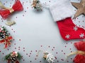Christmas and New Year decorative composition. Top view, background with copy space. Christmas boot, bows, star, pine cone on a Royalty Free Stock Photo