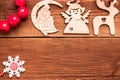 Christmas and New Year decorative wooden handmade crafted toys for xmas tree: deer, angel, Santa and snowflake. Top view Royalty Free Stock Photo