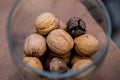 Christmas and New Year details in a photo studio. Nuts in a glass flask (3).