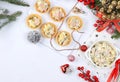 Christmas New Year dishes 2024, traditional holiday olivier salad in a dish and baked baskets with fir branches, cones and