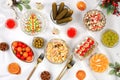 Christmas New Year dishes, traditional Olivier salad, vegetable salad of cucumbers, tomatoes and radishes and a variety Royalty Free Stock Photo