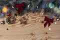 Christmas New Year eve background with fir tree and decoration on light wooden board glare of light Royalty Free Stock Photo