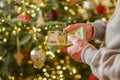 Christmas and New Year expenses.pack of euro money in hands on a Christmas trees background.Spending on gifts and Royalty Free Stock Photo