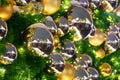 Christmas or New Year festive background, xmas decorations golden and silver balls, shining lights on green pine branches close up Royalty Free Stock Photo