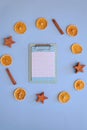 Christmas, New Year flat lay on blue background. Christmas decorations with dry spices, orange rings, cinnamon. Coffee Cup Royalty Free Stock Photo