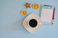 Christmas, New Year flat lay on blue background. Christmas decorations with dry spices, orange rings, cinnamon. Coffee Cup Royalty Free Stock Photo