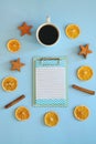 Christmas, New Year flat lay on blue background. Christmas decorations with dry spices, orange rings, cinnamon. Coffee Cup Royalty Free Stock Photo