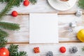 Christmas or New Year frame composition. Decorations, red balls, cones, fir and spruce branches, on a white wooden background. Top Royalty Free Stock Photo