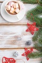Christmas or New Year frame composition. Decorations, red stars, bells, cones, fir and spruce branches, on a white wooden Royalty Free Stock Photo