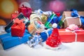 Christmas or New Year gifts with ribbon in snow on bokeh background. Stack of colorful gift boxes. Copy space for text. Winter Royalty Free Stock Photo