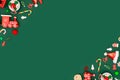 Christmas or New Year green background with diagonal red toys borders. Royalty Free Stock Photo