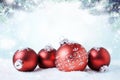 Christmas and New Year greeting card. Holiday ornament, winter decoration. Red christmas ball over snow background, with copy Royalty Free Stock Photo