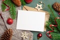 Christmas or New Year greeting card mockup with envelope and festive decorations