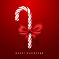 Christmas or New Year greeting card. Realistic candy cane with red bow and ribbon on red background. Vector illustration