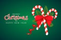 Christmas and New Year greeting card template with candies, fir branches, red bow and ribbon on green background Royalty Free Stock Photo