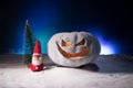 Christmas New Year or Halloween Celebrate Background with Little Christmas Tree on Blurred Bokeh Snow Background with horror Royalty Free Stock Photo