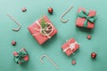 Christmas and New Year holiday background. Red gift boxes with bows and Christmas balls on green background. Top view Royalty Free Stock Photo