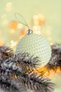 Christmas and New Year Holiday greeting card. Beautiful ball, pine branches and a garland in the snow. Royalty Free Stock Photo