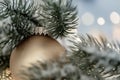 Christmas and New Year Holiday greeting card. Beautiful silver ball, pine branches and a garland in the snow. Royalty Free Stock Photo