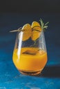 Christmas and New Year holiday welcome yellow orange cocktail with tangerine drink