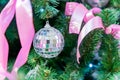 Christmas and New Year holidays background. Christmas tree decorated with silver disko balls, bows and garlands. Glittering and Royalty Free Stock Photo