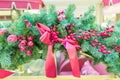 Christmas and New Year holidays background. Christmas tree decorated with sred baw and berries. Glittering and sparkling.