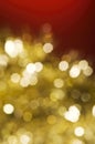Christmas and New Year holidays blurred golden sparkles on red background Royalty Free Stock Photo