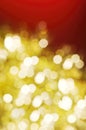 Christmas and New Year holidays blurred golden sparkles on red background Royalty Free Stock Photo