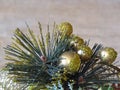 Christmas New year home decor. Diverse decoration in a silver bowl. Table decoration. Pine branch, shining golden balls. Royalty Free Stock Photo