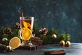 Christmas or New Year hot winter drink, spicy grog cocktail, punch or mulled wine with tea, lemon, rum, cinnamon, anise. Rustic Royalty Free Stock Photo