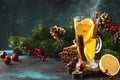 Christmas or New Year hot winter drink, spicy grog cocktail, sangria or mulled wine with tea, lemon, rum, cinnamon, anise. Rustic Royalty Free Stock Photo