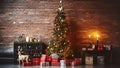 Christmas, New Year interior with red brick wall background, decorated fir tree with garlands and balls, dark drawer and deer Royalty Free Stock Photo