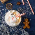 Christmas and New Year. Marshmallow snowman in hot latte in a mug. In the square for Instagram
