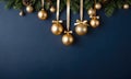 Golden and blue Glass Balls hanging on ribbon on Navy blue background with copy space for text Royalty Free Stock Photo