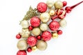 Christmas or new year pattern of red and gold glass Christmas balls on a white background. the apartment lay, top view Royalty Free Stock Photo