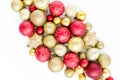 Christmas or new year pattern of red and gold glass Christmas balls on a white background. the apartment lay, top view Royalty Free Stock Photo