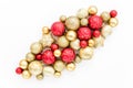 Christmas or new year pattern of red and gold glass Christmas balls on a white background. the apartment lay, top view Royalty Free Stock Photo