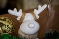 Christmas and New Year photo studio, green tree, ceramic figurine, white wall.