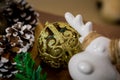 Christmas and New Year photo studio, green tree, cones tree, ceramic figurine, white wall (2).