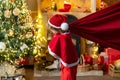 For Christmas and New Year posters. Funny little Santa Claus with huge red bag with presents. Santa child. Boy child Royalty Free Stock Photo