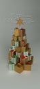 Christmas and New Year presents in the pile with the shape of the Christmas tree. With white greeting text